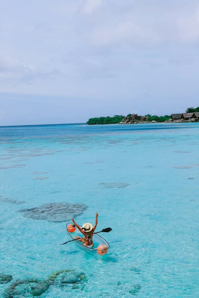 Overwater villas surrounded by a turquoise Maldivian lagoon
